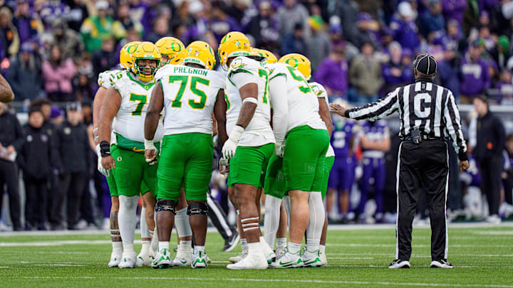Oregon huddles up as the Oregon Ducks take on the Washington Huskies on Nov. 29, 2025, at Husky Stadium in Seattle, Washington. Oregon huddles up as the Oregon Ducks take on the Washington Huskies on Nov. 29, 2025, at Husky Stadium in Seattle, Washington.