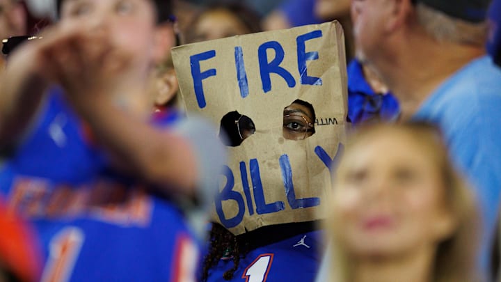 Oct 18, 2025; Gainesville, Florida, USA; A fan wears a Fire Billy Napier bag over their head between the Florida Gators and Mississippi State Bulldogs. Oct 18, 2025; Gainesville, Florida, USA; A fan wears a Fire Billy Napier bag over their head between the Florida Gators and Mississippi State Bulldogs.