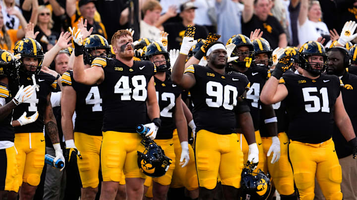 Iowa Hawkeyes football players do the wave after the first quarter against the Albany Great Danes Aug. 30, 2025 at Kinnick Stadium in Iowa City, Iowa.