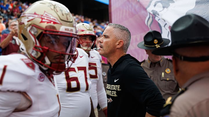 Nov 29, 2025; Gainesville, Florida, USA; Florida State Seminoles head coach Mike Norvell waits to run on the field before a game against the Florida Gators at Ben Hill Griffin Stadium. Mandatory Credit: Matt Pendleton-Imagn Images