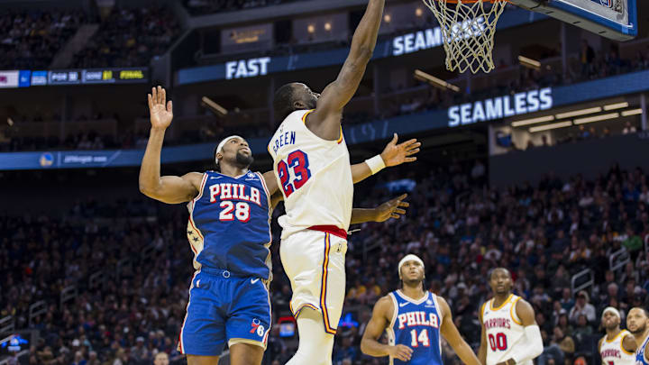 Jan 2, 2025; San Francisco, California, USA; Golden State Warriors forward Draymond Green (23) scores as Philadelphia 76ers forward Guerschon Yabusele (28) defends during the fourth quarter at Chase Center. Mandatory Credit: John Hefti-Imagn Images