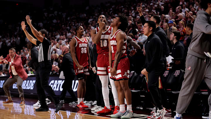 Jan 11, 2025; College Station, Texas, USA; Alabama Crimson Tide players on the bench react after a made basket against the Texas A&M Aggies during the second half at Reed Arena. Mandatory Credit: Erik Williams-Imagn Images