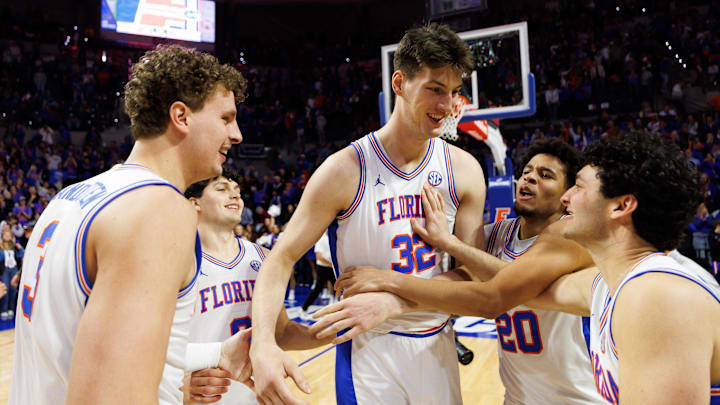 Feb 1, 2026; Gainesville, Florida, USA; Florida Gators center Micah Handlogten (3), Florida Gators guard Alex Kovatchev (8), Florida Gators guard Isaiah Brown (20) and Florida Gators guard Cooper Josefsberg (33) celebrate with Florida Gators center Olivier Rioux (32) after a game against the Alabama Crimson Tide at Exactech Arena at the Stephen C. O'Connell Center. Mandatory Credit: Matt Pendleton-Imagn Images