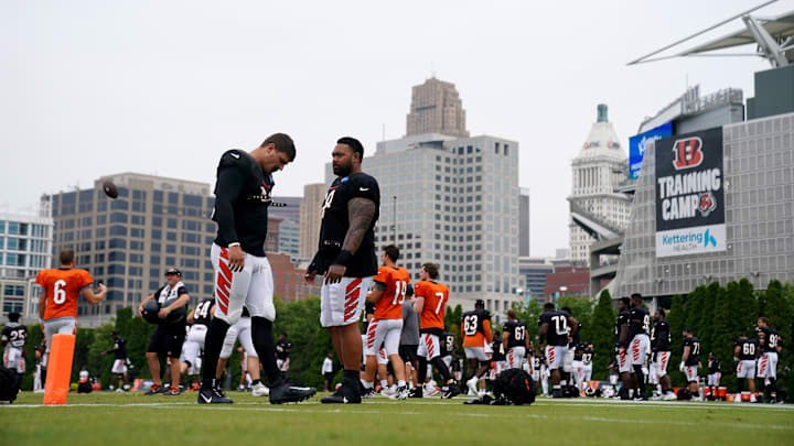 Aug 9, 2023; Cincinnati, OH, USA; Cincinnati Bengals defensive end Trey Hendrickson (91), left, and Cincinnati Bengals defensive tackle Josh Tupou (68), right, talk as the team stretches during a joint practice between the Green Bay Packers and the Cincinnati Bengals, Wednesday, Aug. 9, 2023, at the practice fields next to Paycor Stadium in Cincinnati. Mandatory Credit: Kareem Elgazzar-USA TODAY Sports Aug 9, 2023; Cincinnati, OH, USA; Cincinnati Bengals defensive end Trey Hendrickson (91), left, and Cincinnati Bengals defensive tackle Josh Tupou (68), right, talk as the team stretches during a joint practice between the Green Bay Packers and the Cincinnati Bengals, Wednesday, Aug. 9, 2023, at the practice fields next to Paycor Stadium in Cincinnati. Mandatory Credit: Kareem Elgazzar-USA TODAY Sports
