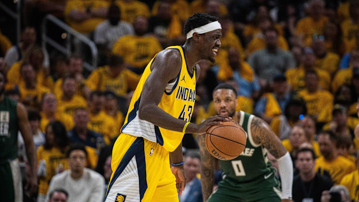 May 2, 2024; Indianapolis, Indiana, USA: Indiana Pacers forward Pascal Siakam (43) dribbles the ball while Milwaukee Bucks guard Damian Lillard (0) defends during game six of the first round for the 2024 NBA playoffs at Gainbridge Fieldhouse. Mandatory Credit: Trevor Ruszkowski-Imagn Images