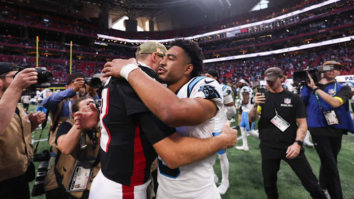 Nov 16, 2025; Atlanta, Georgia, USA; Carolina Panthers quarterback Bryce Young (9) shakes hands with Atlanta Falcons quarterback Kirk Cousins (18) after the game at Mercedes-Benz Stadium. Mandatory Credit: Brett Davis-Imagn Images Nov 16, 2025; Atlanta, Georgia, USA; Carolina Panthers quarterback Bryce Young (9) shakes hands with Atlanta Falcons quarterback Kirk Cousins (18) after the game at Mercedes-Benz Stadium. Mandatory Credit: Brett Davis-Imagn Images