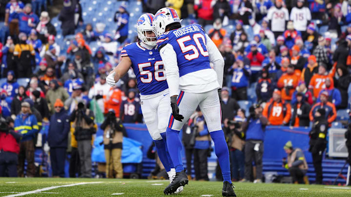 Buffalo Bills linebacker Matt Milano (58) and defensive end Greg Rousseau (50) celebrate a sack during the fourth quarter against the Denver Broncos
