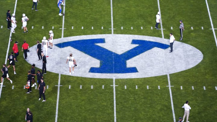 The Cincinnati Bearcats and the Brigham Young Cougars warm up prior to a college football game between the Brigham Young Cougars and the Cincinnati Bearcats, Friday, Sept. 29, 2023, at LaVell Edwards Stadium in Provo, Utah.