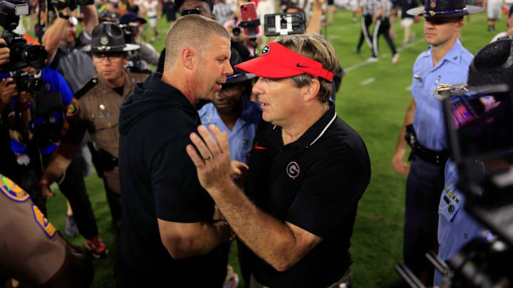 Florida Gators head coach Billy Napier, left, and Georgia Bulldogs head coach Kirby Smart shake hands after the game of an NCAA Football game Saturday, Oct. 28, 2023 at EverBank Stadium in Jacksonville, Fla. Georgia defeated Florida 43-20. [Corey Perrine/Florida Times-Union]