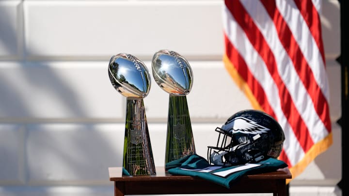 Apr 28, 2025; Washington, DC, USA; Two Vince Lombardi Trophies, a helmet and jersey on a table before President Donald Trump honors the Super Bowl LIX champion Philadelphia Eagles at The White House in Washington D.C., on April 28, 2025. Apr 28, 2025; Washington, DC, USA; Two Vince Lombardi Trophies, a helmet and jersey on a table before President Donald Trump honors the Super Bowl LIX champion Philadelphia Eagles at The White House in Washington D.C., on April 28, 2025.