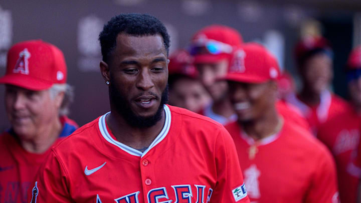 Feb 27, 2025; Mesa, Arizona, USA; Los Angeles Angels infielder Tim Anderson (77) celebrates with his team after hitting a home run in the first inning during a spring training game against the Chicago Cubs at Sloan Park. Mandatory Credit: Allan Henry-Imagn Images