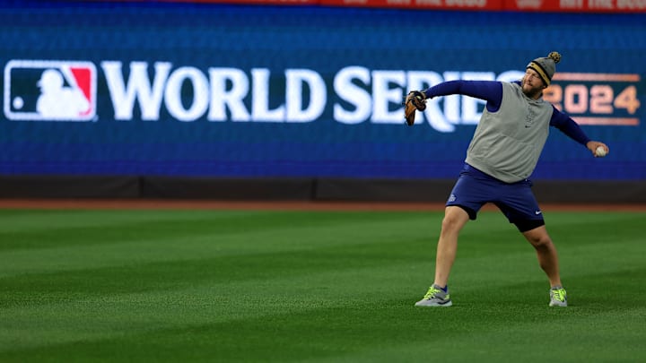 Oct 27, 2024; New York, NY, USA; Los Angeles Dodgers injured pitcher Clayton Kershaw throws in the outfield during workouts a day before game three of the World Series against the New York Yankees at Yankees Stadium. Mandatory Credit: Brad Penner-Imagn Images