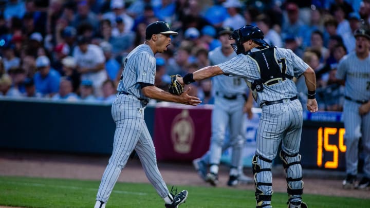 May 24, 2024; Charlotte, NC, USA; Wake Forest pitcher Chase Burns (29) celebrates with catcher Cameron Gill (27) after a strikeout in the third inning against the North Carolina Tar Heels during the ACC Baseball Tournament at Truist Field. Mandatory Credit: Scott Kinser-USA TODAY Sports May 24, 2024; Charlotte, NC, USA; Wake Forest pitcher Chase Burns (29) celebrates with catcher Cameron Gill (27) after a strikeout in the third inning against the North Carolina Tar Heels during the ACC Baseball Tournament at Truist Field. Mandatory Credit: Scott Kinser-USA TODAY Sports