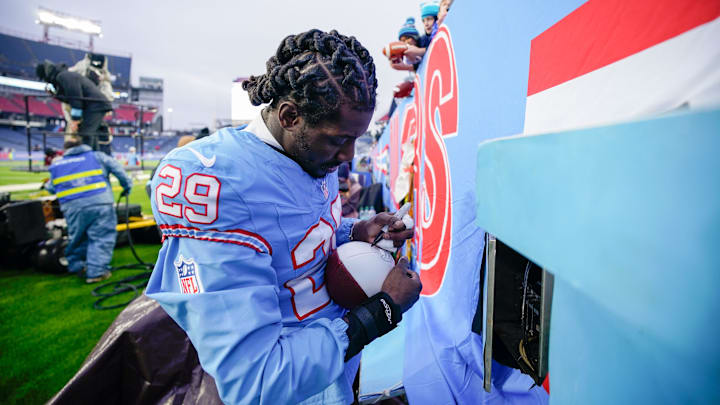 Tennessee Titans cornerback Jarvis Brownlee Jr. (29) signs a football after the game with the Houston Texans at Nissan Stadium in Nashville, Tenn., Sunday, Jan. 5, 2025. Tennessee Titans cornerback Jarvis Brownlee Jr. (29) signs a football after the game with the Houston Texans at Nissan Stadium in Nashville, Tenn., Sunday, Jan. 5, 2025.