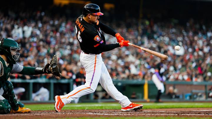 Jun 23, 2026; San Francisco, California, USA; San Francisco Giants third baseman Matt Chapman (26) hits an RBI single during the second inning against the Athletics at Oracle Park. Mandatory Credit: Sergio Estrada-Imagn Images