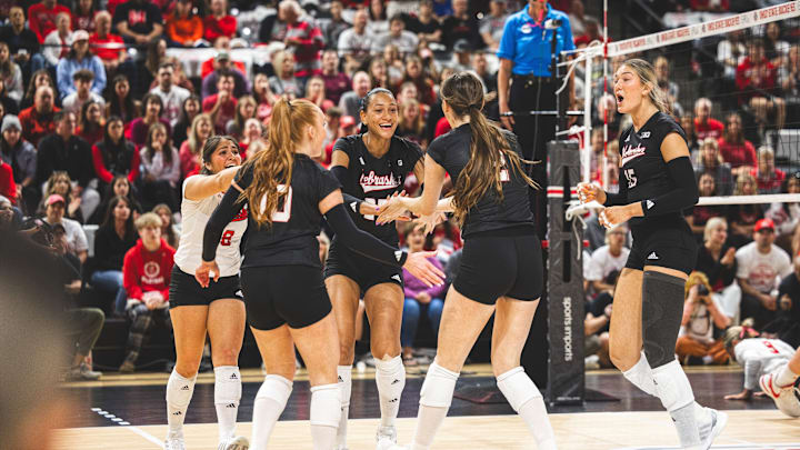 Nebraska volleyball players celebrate a point at Ohio State.