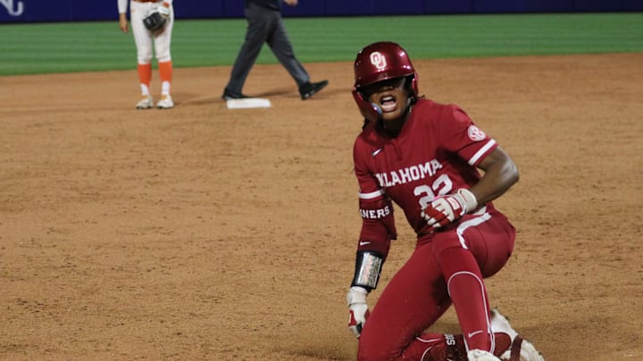 Oklahoma outfielder Kai Minor slides into third after hitting a triple against Oklahoma State in a Bedlam contest at Devon Park.