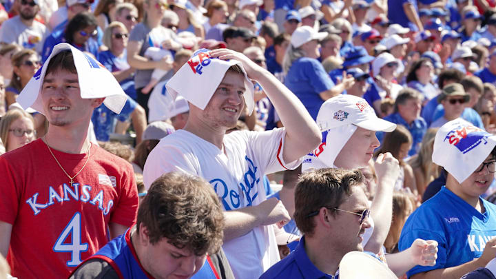 Sep 24, 2022; Lawrence, Kansas, USA; A general view as Kansas Jayhawks fans put towels over their heads to stay cool against the Duke Blue Devils during the game at David Booth Kansas Memorial Stadium. Mandatory Credit: Denny Medley-Imagn Images