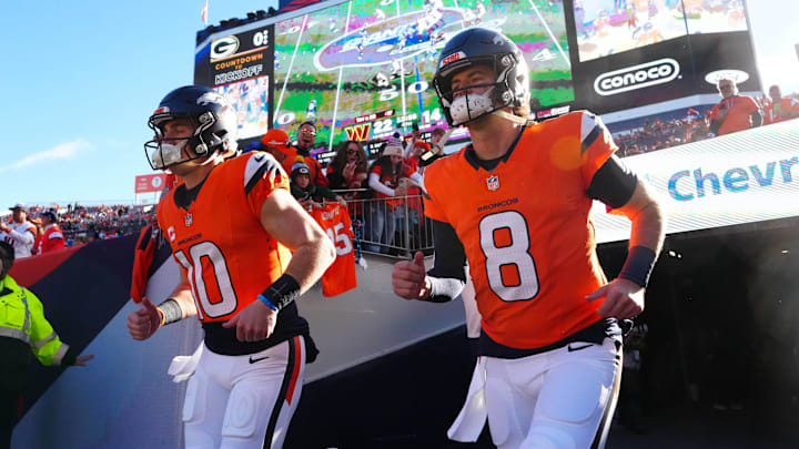 Broncos quarterbacks Bo Nix and Jarrett Stidham take the field against the Packers.