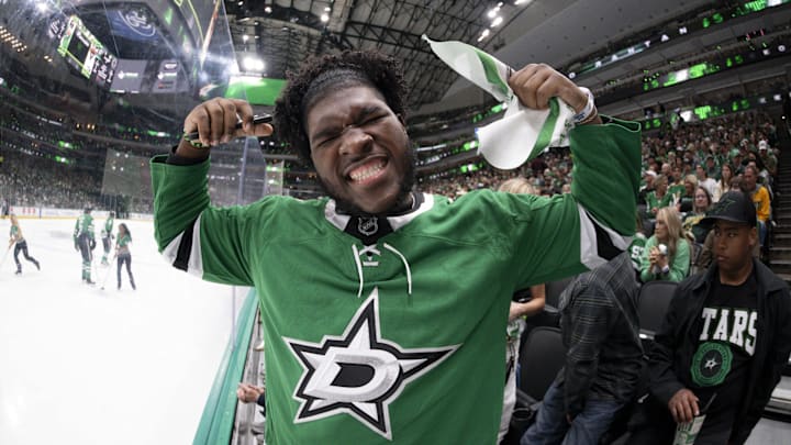 May 11, 2025; Dallas, Texas, USA; Dallas Cowboys 2025 first round pick Tyler Booker poses for a photo during the first period between the Dallas Stars and the Winnipeg Jets in game three of the second round of the 2025 Stanley Cup Playoffs at American Airlines Center. Mandatory Credit: Jerome Miron-Imagn Images