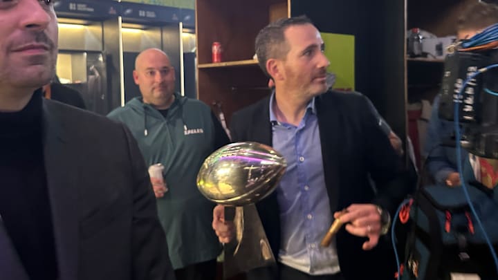 General manager Howie Roseman works his way through the Eagles locker room after winning Super Bowl LIX against the Kansas City Chiefs.