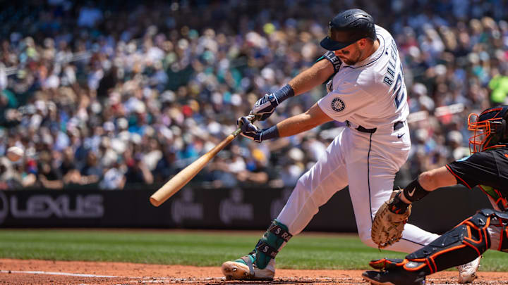 Seattle Mariners catcher Cal Raleigh hits a single during a game against the Baltimore Orioles on June 5 at T-Mobile Park.
