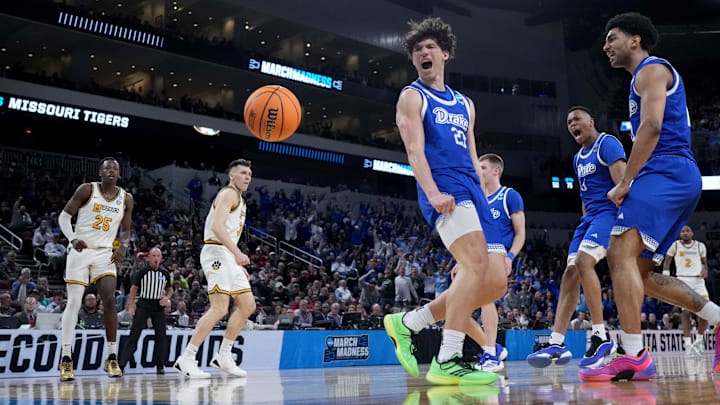 Mar 20, 2025; Wichita, KS, USA; Drake Bulldogs guard Isaia Howard (23) reacts after a dunk against Missouri Tigers guard T.O. Barrett (5) in the first half of a first round men’s NCAA Tournament game at Intrust Bank Arena. Mandatory Credit: Kirby Lee-Imagn Images