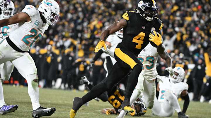 Dec 15, 2025; Pittsburgh, Pennsylvania, USA; Pittsburgh Steelers wide receiver DK Metcalf (4) runs the ball after a catch for