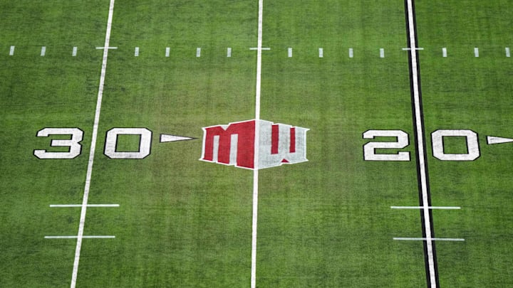 The Mountain West conference logo on the field at Allegiant Stadium. Mandatory Credit: Kirby Lee-Imagn Images