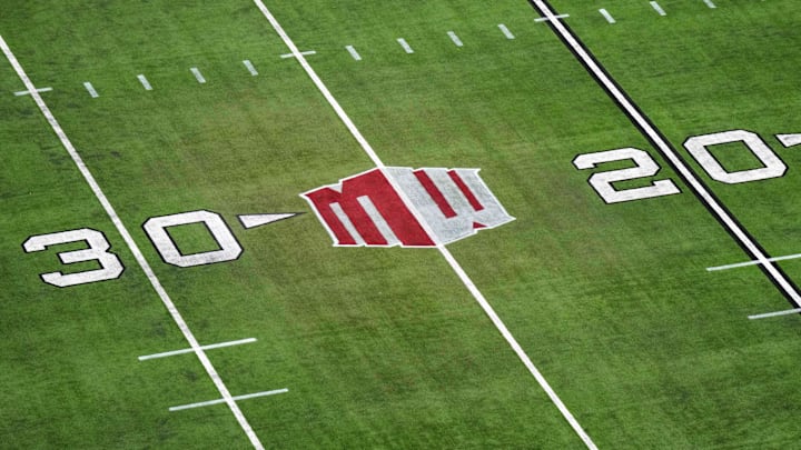 The Mountain West conference logo on the field at Allegiant Stadium. Mandatory Credit: Kirby Lee-Imagn Images