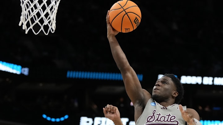 March 21, 2024, Charlotte, NC, USA;  Mississippi State Bulldogs guard Josh Hubbard (13) shoots against Michigan State Spartans guard Jaden Akins (3) in the first round of the 2024 NCAA Tournament at the Spectrum Center. Mandatory Credit: Bob Donnan-Imagn Images