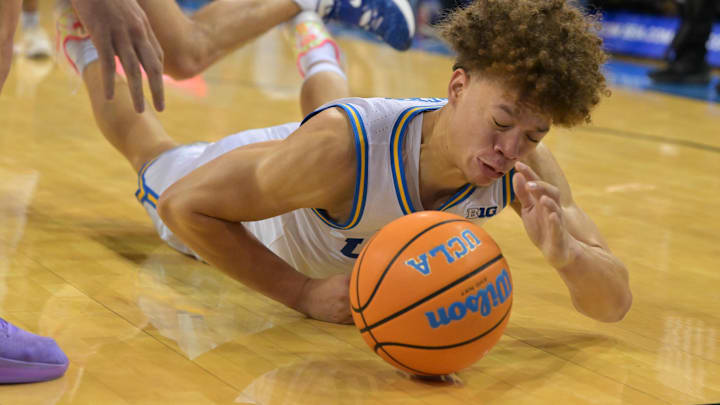 Dec 23, 2025; Los Angeles, California, USA; UC Riverside Highlanders forward Dylan Godfrey (23) and UCLA Bruins guard Trent Perry (0) chase down a loose ball in the second half at Pauley Pavilion presented by Wescom Financial. Mandatory Credit: Jayne Kamin-Oncea-Imagn Images Dec 23, 2025; Los Angeles, California, USA; UC Riverside Highlanders forward Dylan Godfrey (23) and UCLA Bruins guard Trent Perry (0) chase down a loose ball in the second half at Pauley Pavilion presented by Wescom Financial. Mandatory Credit: Jayne Kamin-Oncea-Imagn Images