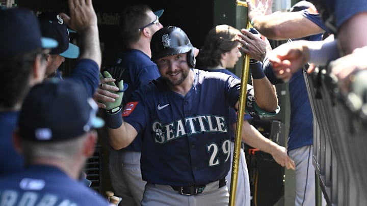 Seattle Mariners catcher Cal Raleigh (29) celebrates in the dugout after hitting a home run against the Chicago Cubs on June 20 at Wrigley Field. Seattle Mariners catcher Cal Raleigh (29) celebrates in the dugout after hitting a home run against the Chicago Cubs on June 20 at Wrigley Field.
