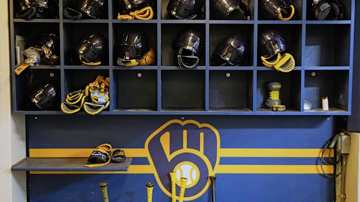 Apr 5, 2025; Milwaukee, Wisconsin, USA;  General view of Milwaukee Brewers batting helmets in the dugout prior to the game against the Cincinnati Reds at American Family Field. Mandatory Credit: Jeff Hanisch-Imagn Images