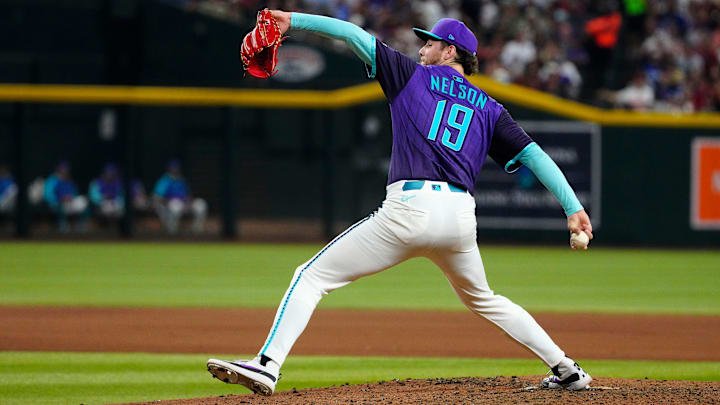 Diamondbacks pitcher Ryne Nelson (19) pitches in relief against the Dodgers in the ninth inning during a game at Chase Field on May 10, 2025, in Phoenix. Diamondbacks pitcher Ryne Nelson (19) pitches in relief against the Dodgers in the ninth inning during a game at Chase Field on May 10, 2025, in Phoenix.