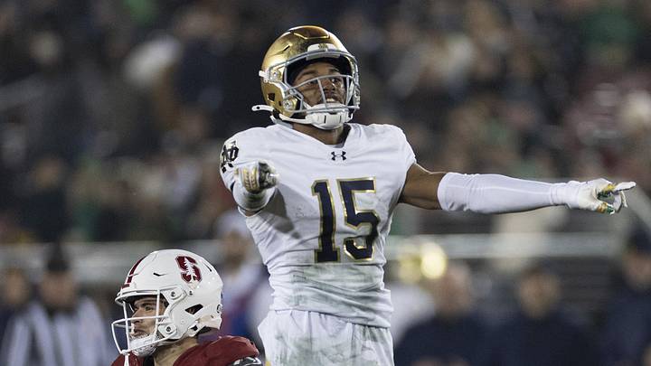 Stanford Cardinal wide receiver Bryce Farrell (11) and Notre Dame Fighting Irish cornerback Leonard Moore (15).
