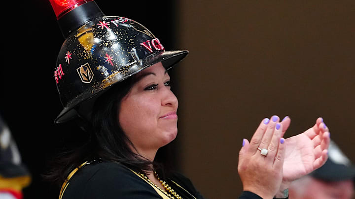 Apr 19, 2026; Las Vegas, Nevada, USA; A Vegas Golden Knights fan applauds after the Golden Knights defeated the Utah Mammoth 4-2 in game one of the first round of the 2026 Stanley Cup Playoffs at T-Mobile Arena. Mandatory Credit: Stephen R. Sylvanie-Imagn Images