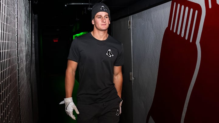 Top Red Sox prospect Roman Anthony walks toward the batting cage Tuesday at Fenway Park.