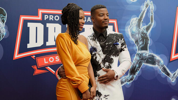 All American -- “Draft Day” -- Image Number: ALA612a_0012r -- Pictured (L-R): Karimah Westbrook as Grace James and Daniel Ezra as Spencer James -- Photo: Troy Harvey/The CW -- © 2024 The CW Network, LLC. All Rights Reserved.