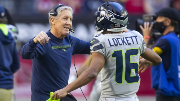 Jan 9, 2022; Glendale, Arizona, USA; Seattle Seahawks head coach Pete Carroll (left) hugs wide receiver Tyler Lockett (16) prior to the game against the Arizona Cardinals at State Farm Stadium. Jan 9, 2022; Glendale, Arizona, USA; Seattle Seahawks head coach Pete Carroll (left) hugs wide receiver Tyler Lockett (16) prior to the game against the Arizona Cardinals at State Farm Stadium.