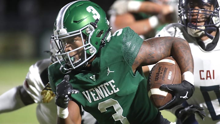 Venice running back Jamarice Wilder (3) rushes for a huge gain against the defense of Clearwater AI during Friday night football action in Venice. Venice running back Jamarice Wilder (3) rushes for a huge gain against the defense of Clearwater AI during Friday night football action in Venice.