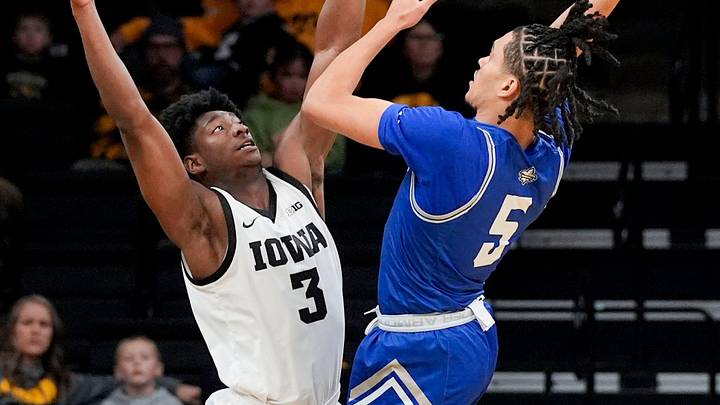 College basketball player James White (in blue)