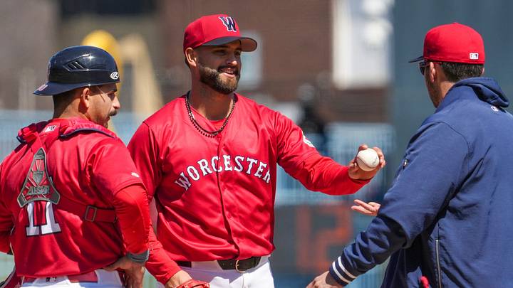 Patrick Sandoval hands the ball to manager Chad Tracy in the fourth inning of his rehab start in Worcester April 8. Patrick Sandoval hands the ball to manager Chad Tracy in the fourth inning of his rehab start in Worcester April 8.