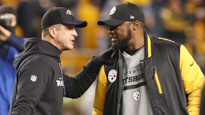 Dec 10, 2017; Pittsburgh, PA, USA;  Baltimore Ravens head coach John Harbaugh (left) and Pittsburgh Steelers head coach Mike Tomlin (right) meet at mid-field before their teams play at Heinz Field. Mandatory Credit: Charles LeClaire-Imagn Images
