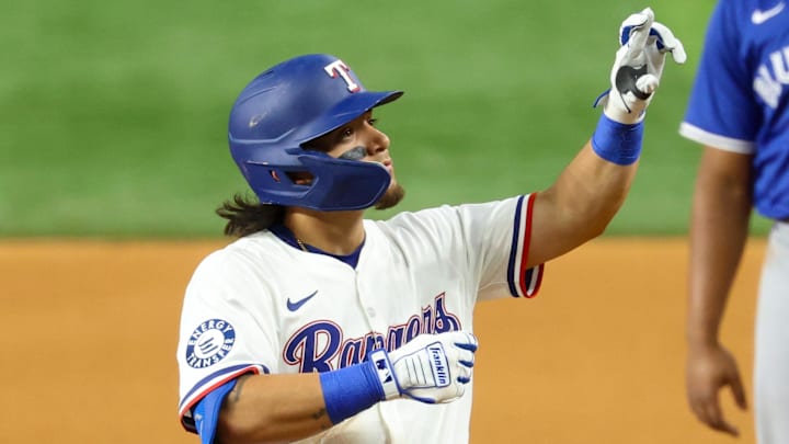 May 27, 2025; Arlington, Texas, USA; Texas Rangers left fielder Alejandro Osuna (19) reacts after a hit during the seventh inning against the Toronto Blue Jays at Globe Life Field. Mandatory Credit: Kevin Jairaj-Imagn Images