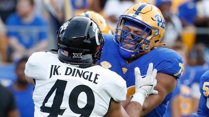 Sep 9, 2023; Pittsburgh, Pennsylvania, USA;  Pittsburgh Panthers offensive lineman Branson Taylor (78) blocks against Cincinnati Bearcats linebacker Jack Dingle (49) during the first quarter at Acrisure Stadium. Mandatory Credit: Charles LeClaire-Imagn Images