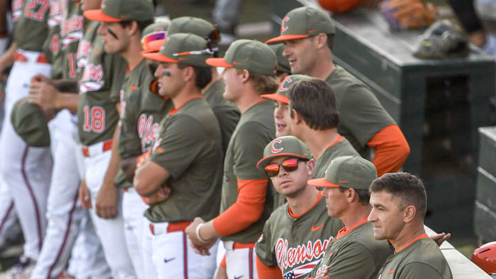 Clemson Head Coach Erik Bakich watches as senior class Clemson ROTC members are recognized on the field, before the game with Clemson and Gardner-Webb University at Doug Kingsmore Stadium in Clemson, S.C. Wednesday, April 9, 2025.