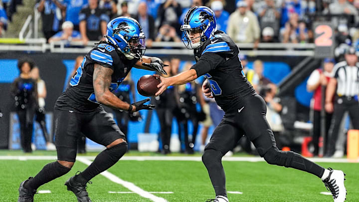 Detroit Lions quarterback Jared Goff (16) hands the ball to running back Jahmyr Gibbs (26) against Seattle Seahawks during the first half at Ford Field in Detroit on Monday, Sept. 30, 2024.