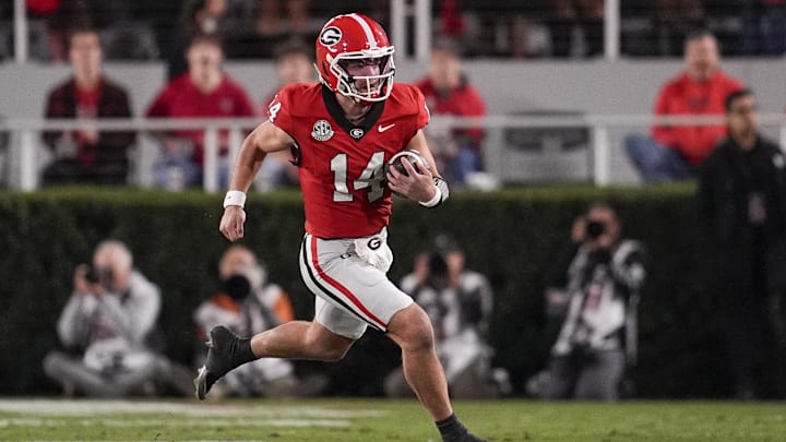 Nov 15, 2025; Athens, Georgia, USA; Georgia Bulldogs quarterback Gunner Stockton (14) runs the ball in the first half against the Texas Longhorns at Sanford Stadium. Mandatory Credit: Dale Zanine-Imagn Images