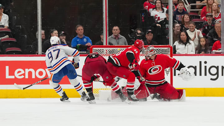 Nov 15, 2025; Raleigh, North Carolina, USA; Edmonton Oilers center Connor McDavid (97) scores a goal past Carolina Hurricanes goaltender Frederik Andersen (31) during the third period at Lenovo Center. Mandatory Credit: James Guillory-Imagn Images Nov 15, 2025; Raleigh, North Carolina, USA; Edmonton Oilers center Connor McDavid (97) scores a goal past Carolina Hurricanes goaltender Frederik Andersen (31) during the third period at Lenovo Center. Mandatory Credit: James Guillory-Imagn Images